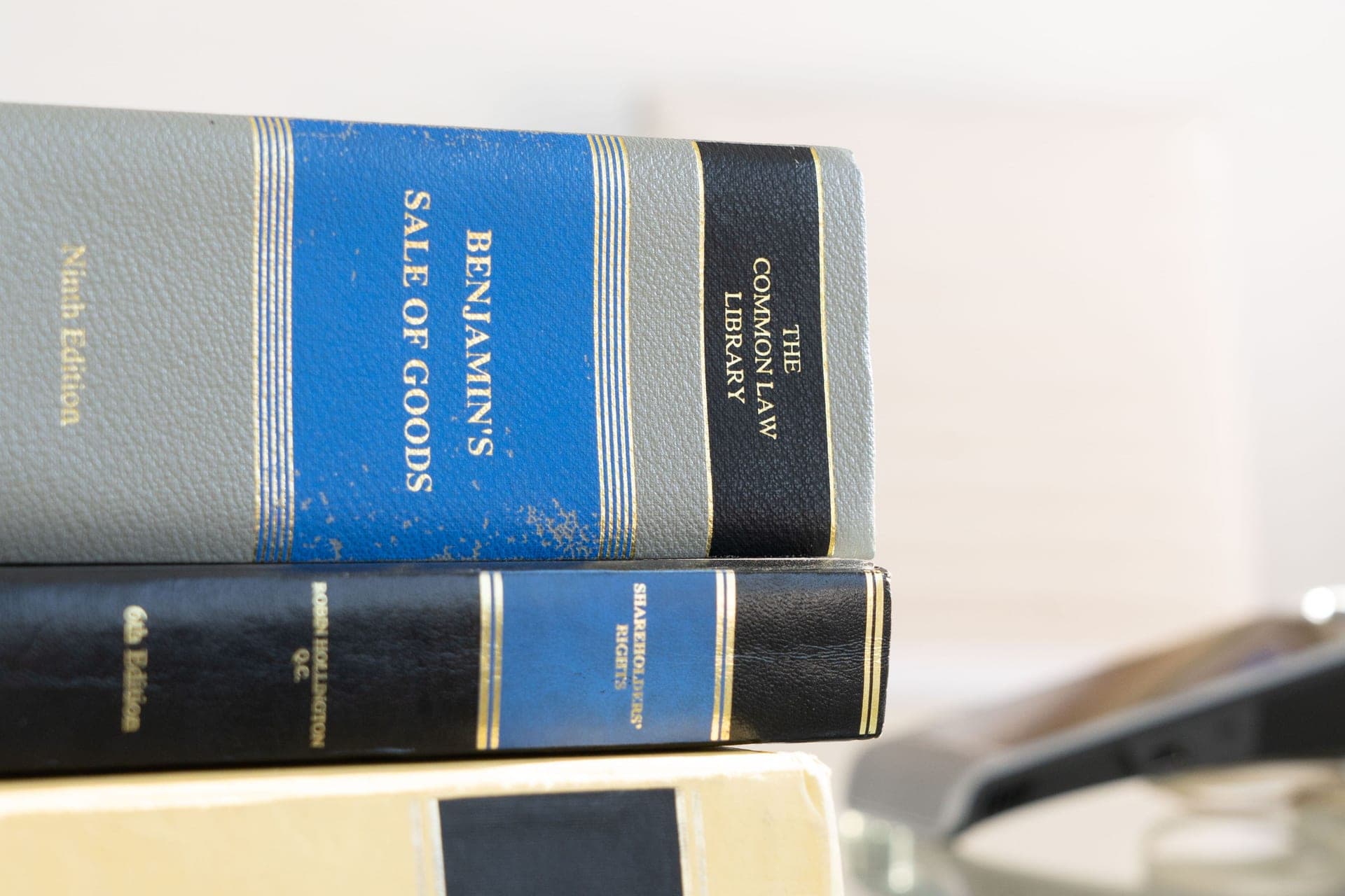 Bound volumes of Benjamin’s Sale of Goods and The Common Law Library stacked on a desk